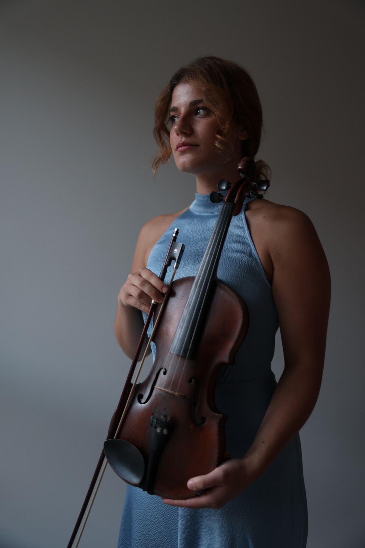 Portrait of Ariadni holding her violin