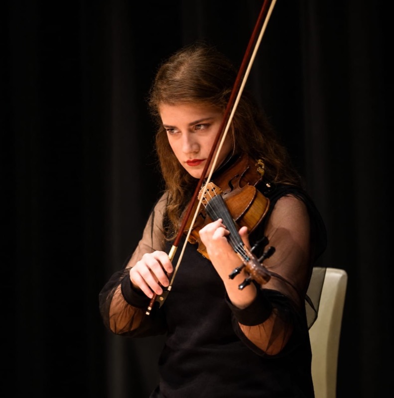 Performing on a dark stage